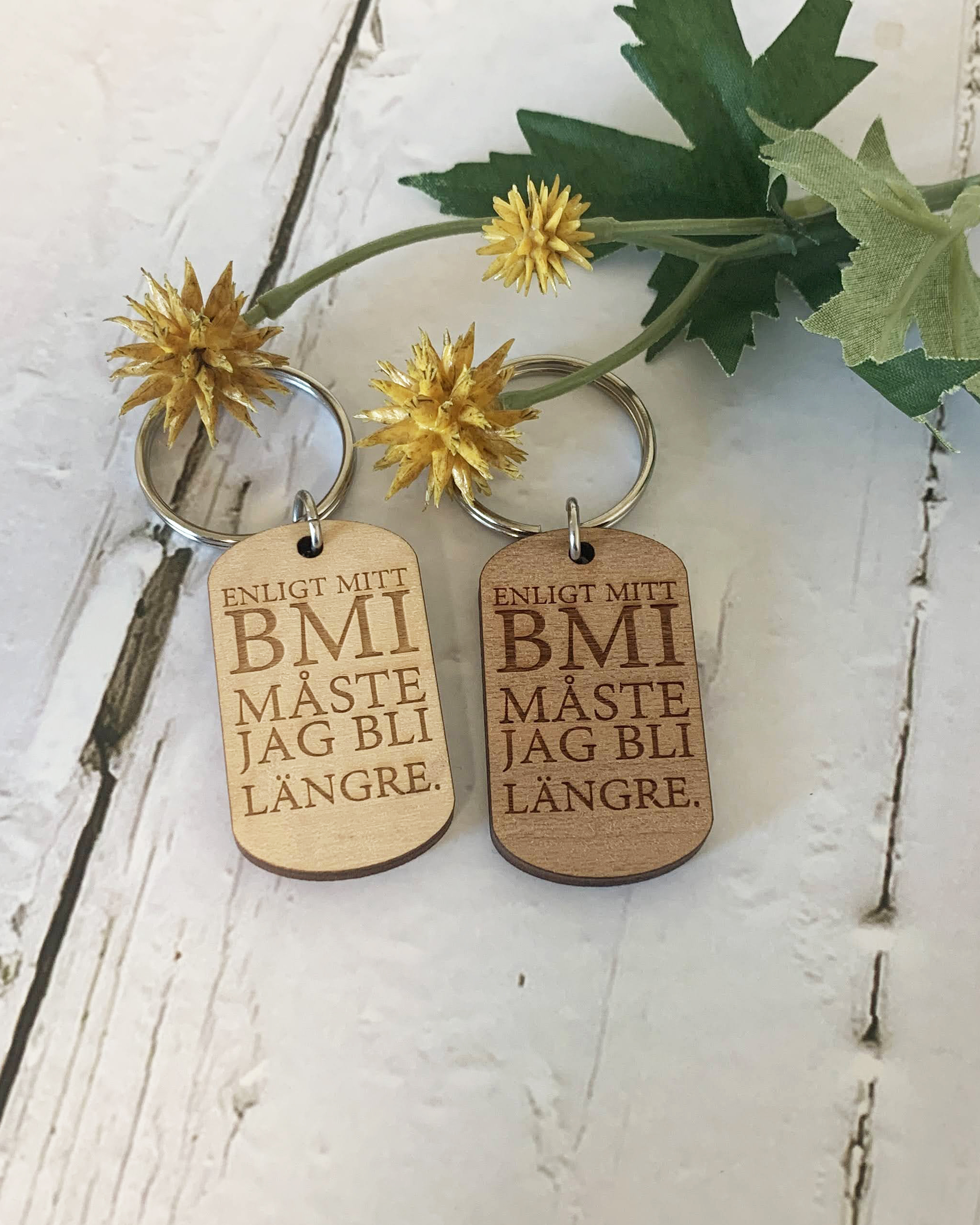 Nyckelring - Enligt mitt BMI måste jag bli längre.